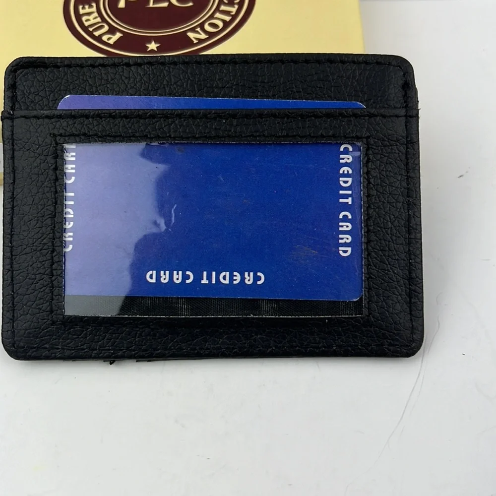 Black leather money clip with credit card and ID pockets. Comes in a box